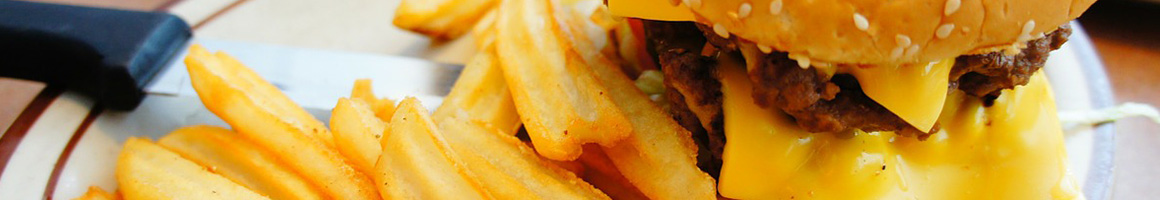 Eating Burger at Burgertown USA restaurant in Redlands, CA.